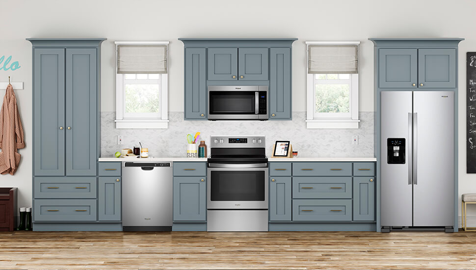 Kitchen With Blue-Gray Cabinets and Stainless Steel Whirlpool Appliances