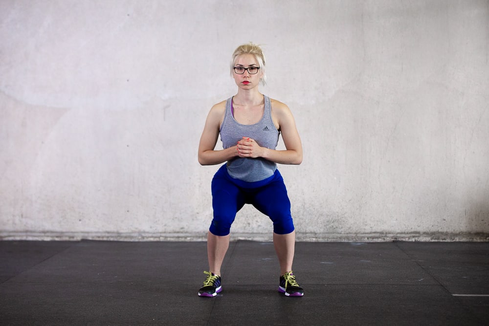 knees going inward during a squat