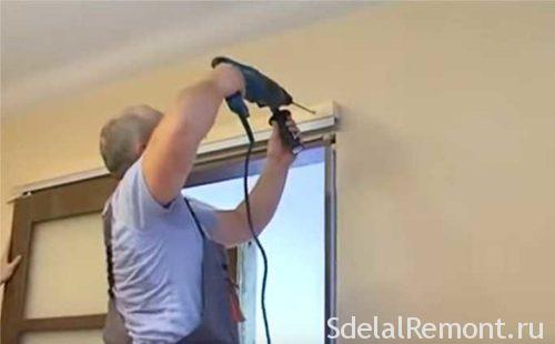Installing sliding interior doors with their hands 