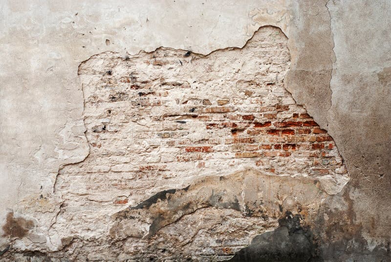 Abandoned grunge cracked brick stucco wall. Background stock photos