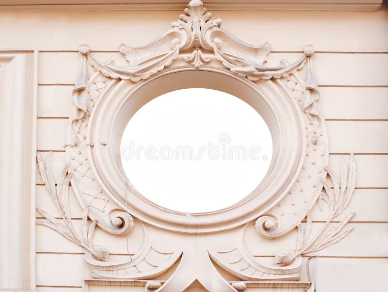 Ancient brick wall with ornate decorative stucco moldings frame. Plate. Architectural background royalty free stock photography