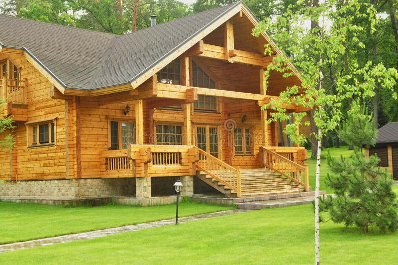 Beautiful wooden house in the forest stock images