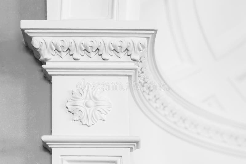 Columnd with stucco relief molding, white interior. Column with stucco relief molding, abstract white interior in classical style royalty free stock photos