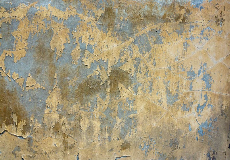 Cracked stucco - grunge background. Grunge texture of the old and damaged stucco - plaster royalty free stock photography