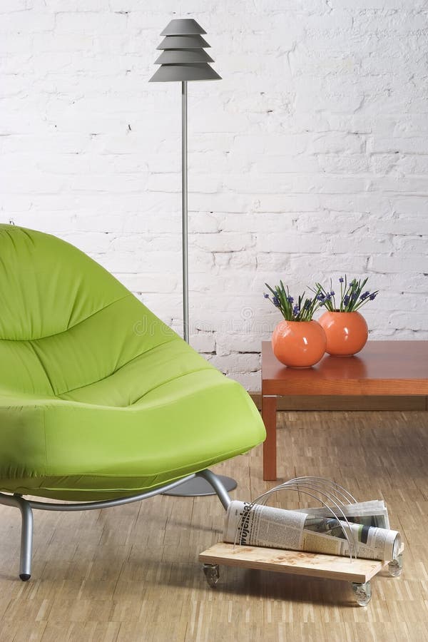 Green chair. On wooden floor royalty free stock images
