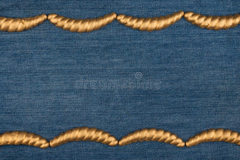 Gypsum cornice, stucco, moldings, friezes on a denim background, copy space. Top view stock photos