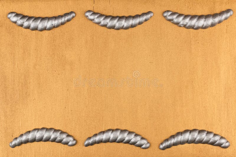 Gypsum cornice, stucco, moldings, friezes on a gold background, copy space. Top view royalty free stock photo