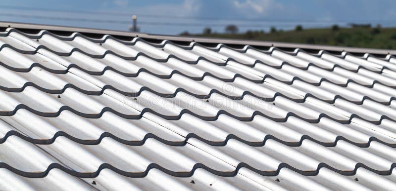 Light gray metal tile roofing, close-up stock photography