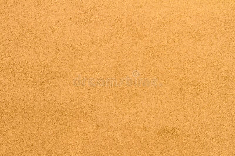 Pale goldenrod stucco wall texture background. High res pale goldenrod stucco wall texture background from small italian village royalty free stock image