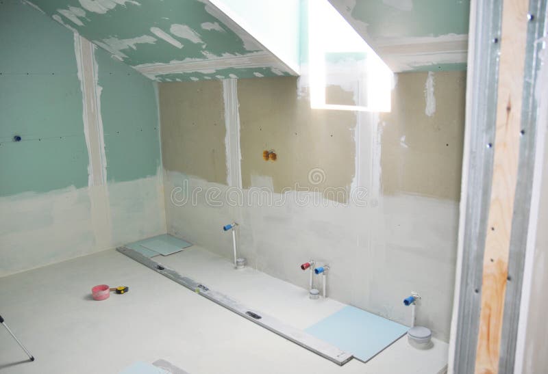 Remodeling attic bathroom with drywall repair, plastering painting, stucco. Bathroom repair and renovation. With gypsum plaster boards stock photography