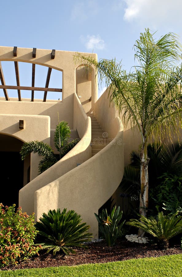 Stucco Stairway. Detail of curved outside stairway of a stucco, adobe-style house royalty free stock photo