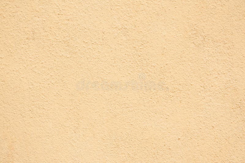 Stucco Wall. Orange Yellow stucco textured wall royalty free stock photo