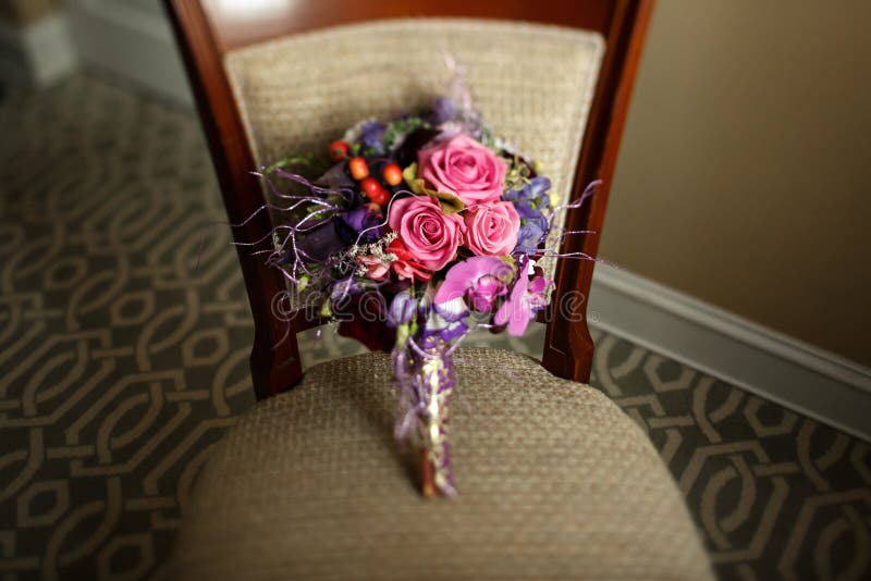 Stylish unusual wedding bouquet on beautiful chair at luxury hot. El in morning stock photography