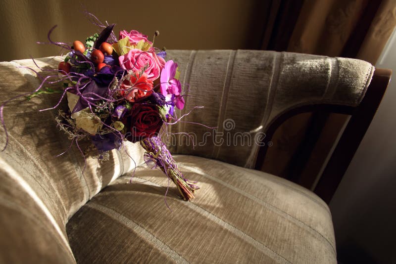 Stylish unusual wedding bouquet on beautiful chair at luxury hot. El in morning stock photography