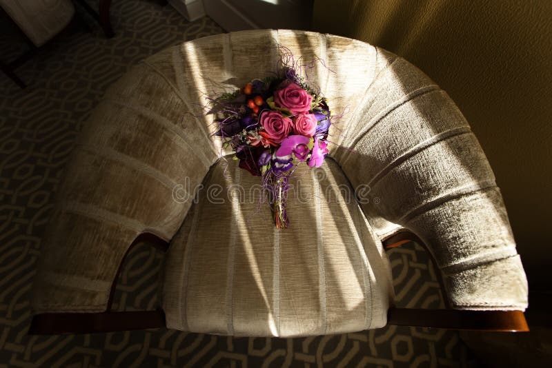 Stylish unusual wedding bouquet on beautiful chair at luxury hot. El in morning stock photos