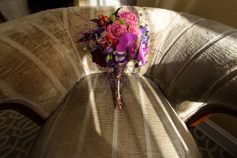 Stylish unusual wedding bouquet on beautiful chair at luxury hot. El in morning royalty free stock photo