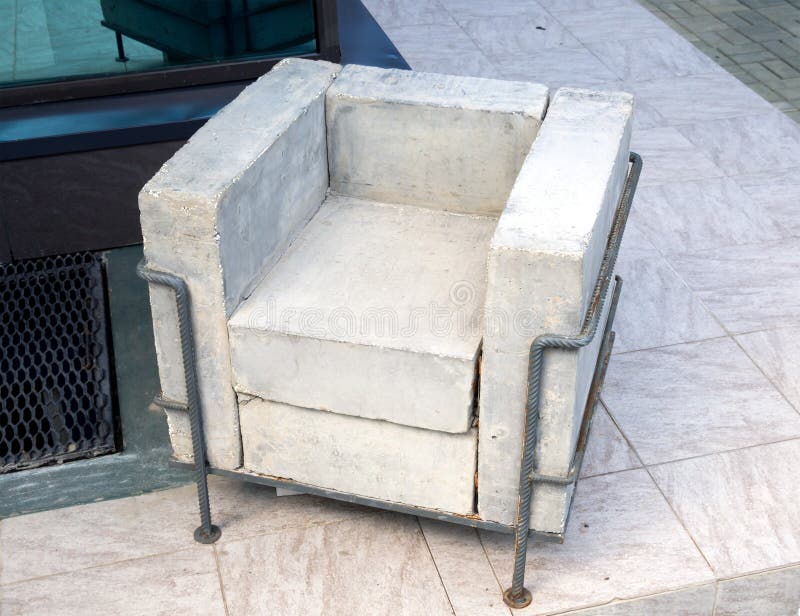 Unusual chair of the concrete and reinforcement.  stock image