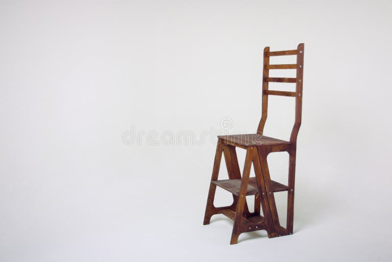 Unusual wooden chair on a white background. An unusual wooden chair, an unusual chair on a cycramram, a wooden chair on a cycramrame, a studio light, an unusual stock image