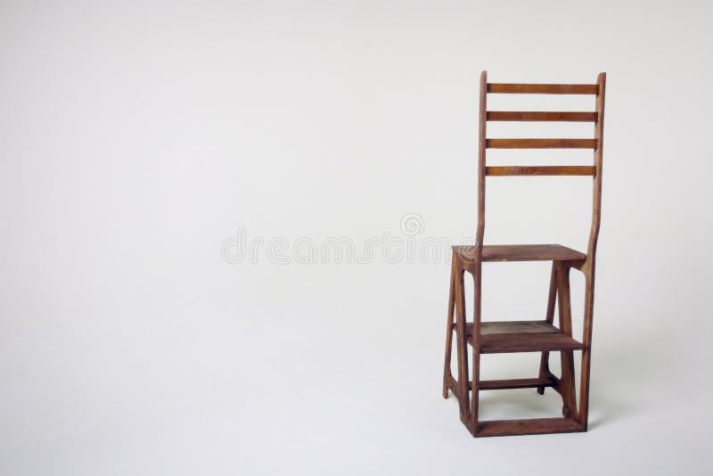 Unusual wooden chair on a white background. An unusual wooden chair, an unusual chair on a cycramram, a wooden chair on a cycramrame, a studio light, an unusual stock photos