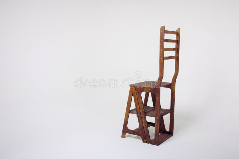 Unusual wooden chair on a white background. An unusual wooden chair, an unusual chair on a cycramram, a wooden chair on a cycramrame, a studio light, an unusual stock image