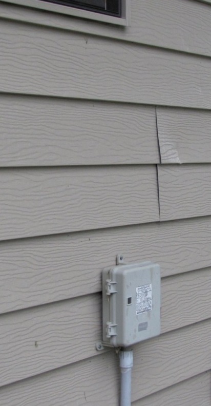 This steel siding is showing evidence of uplift.  (Photo from the Baranek Blog)